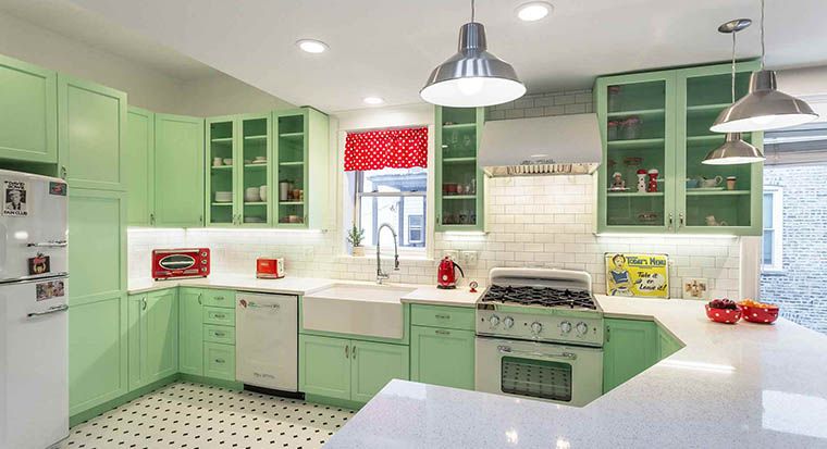 mint green kitchen with porcelain sink with drainboard and wood kitchen table
