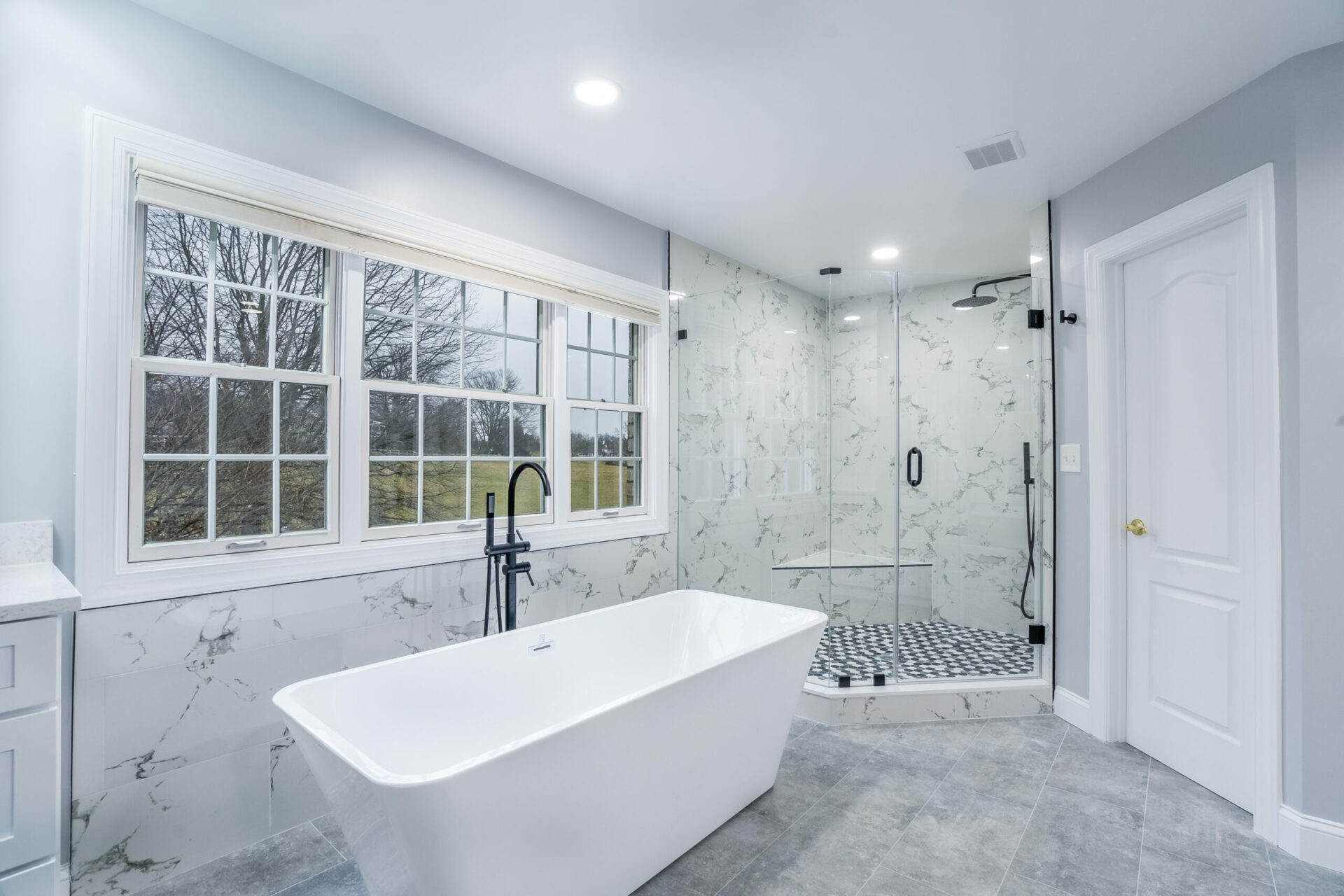 white bathtub tile shower